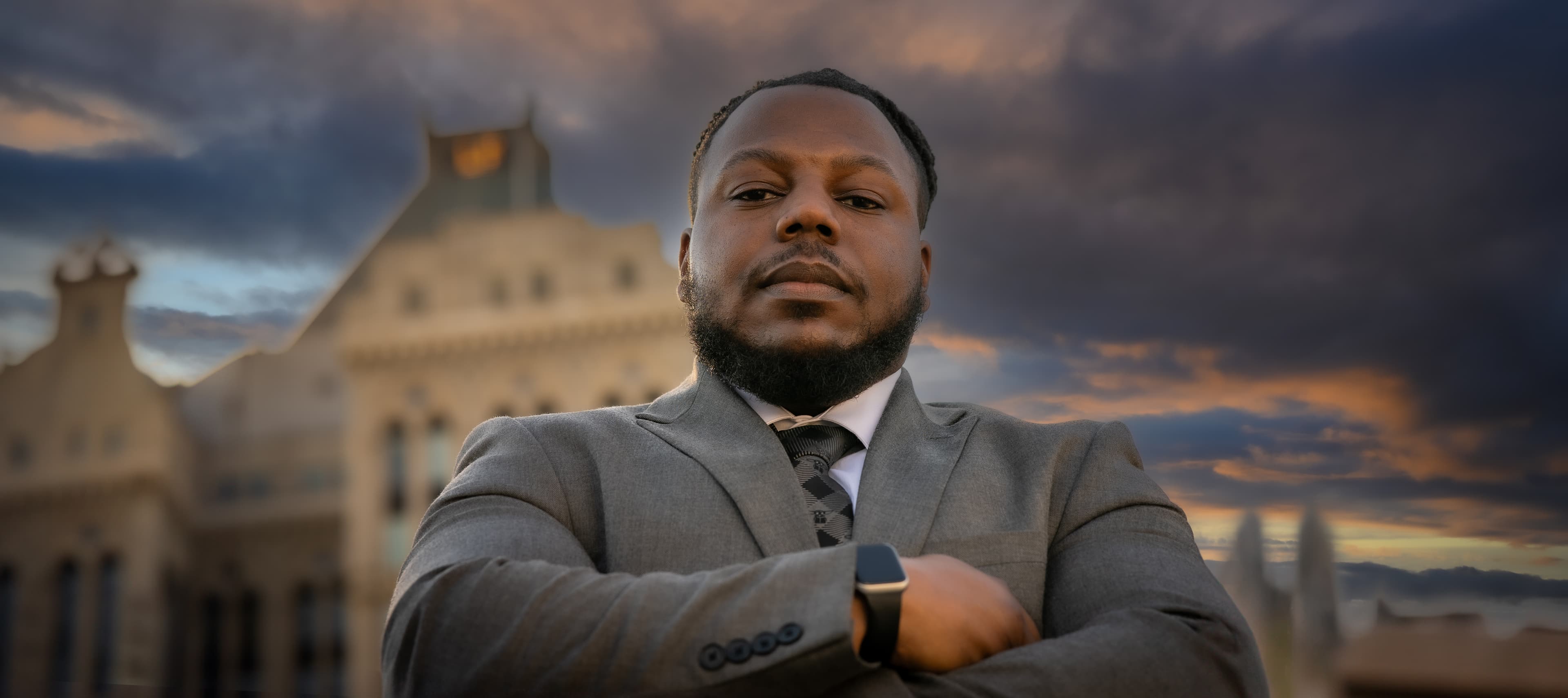 Michael Faison Jr. outside the Guilford County Courthouse at dusk